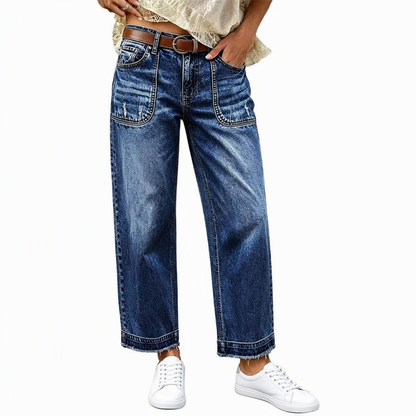 Vintage jeans för damer i stretchtyg med raka ben, slitna påsydda fickor och fransiga, obearbetade benslut